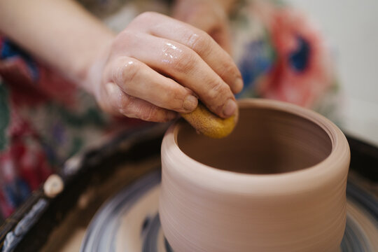 Process of creating a ceramic bowl on the wheel