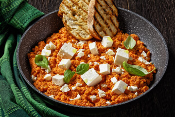 eggs scrambled with tomatoes and feta cheese