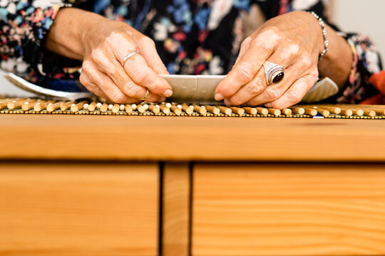 Big close-up of woman hands repairing a broken plate 