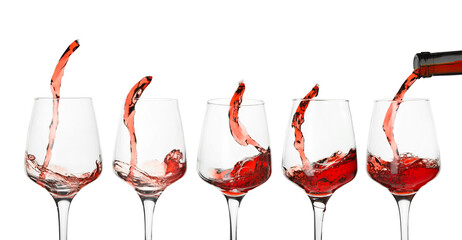 Glasses with splashing red wine on white background