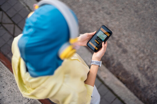 Muslim Runner Using Phone - Powered by Adobe