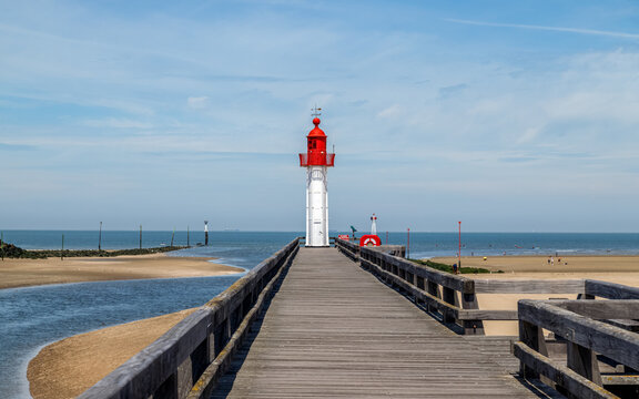 Red lighthouse in Trouville-sur-Mer, famous resort in Normandy, France.