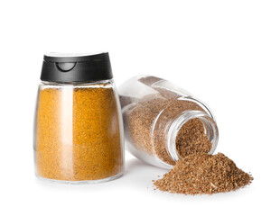 Jars with dried herbs and turmeric powder on white background