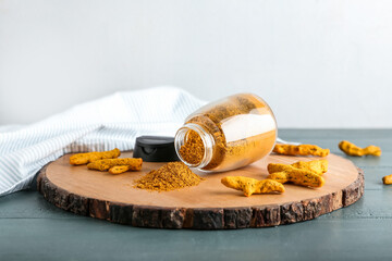 Composition with turmeric powder on table