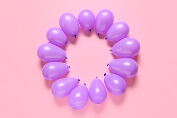 Frame made of air balloons on color background