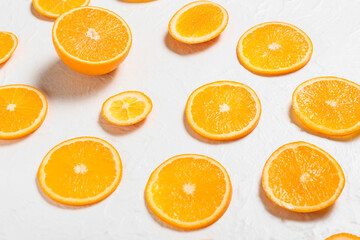 Fresh juicy oranges on light background, closeup