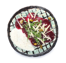 Plate with delicious beetroot carpaccio on white background