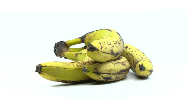 Overripe bananas isolated and rotating on a white background