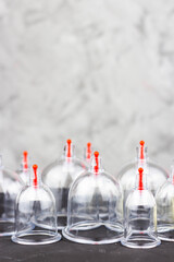 Jars for hijama on a black background. Bloodletting, Traditional Chinese Medicine, Sunnah Healing.