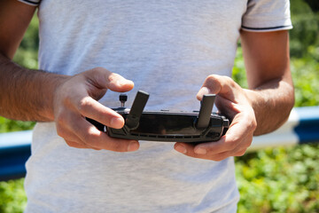 A man holds a drone control panel