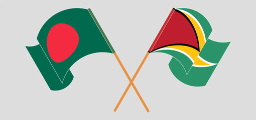 Crossed and waving flags of Bangladesh and Guyana