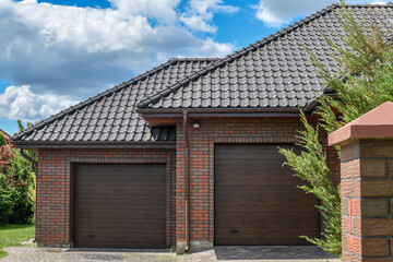 Double automatic doors to the garage with short driveway.