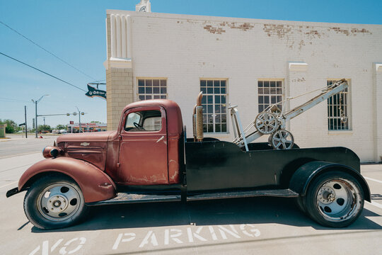 Shamrock, Texas - May 6, 2021: The classic Conoco Tower Gas Station and U-Drop Inn along historic Route 66 - old truck parked outside