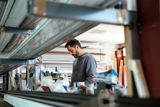 Man at workbench in metal cutting workshop