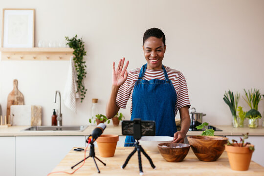 Happy black gardener greeting blog audience