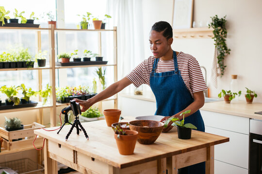 Black gardener preparing to shoot video for vlog