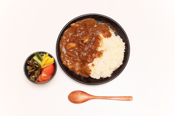 黒い皿に盛ったカレーライス