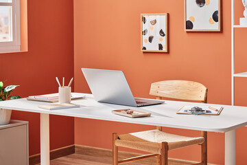 Laptop on table in modern apartment