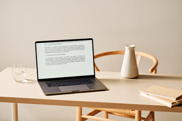 Laptop on table in minimalist style workplace