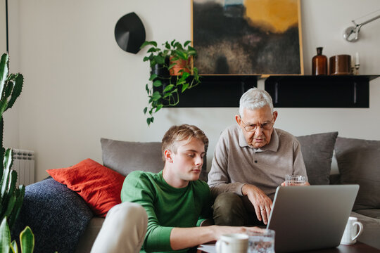 A Young Man and His Grandfather at Home