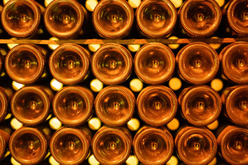 Champagne grand cru sparkling wine production in bottles in rows in underground cellars, Reims,...