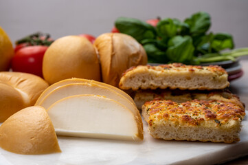 Cheese collection, Italian yellow smoked caciocavallo or scamorza cheese