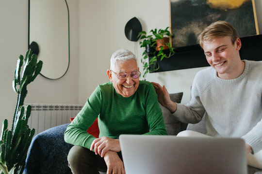 Young Man and His Grandfather at Home