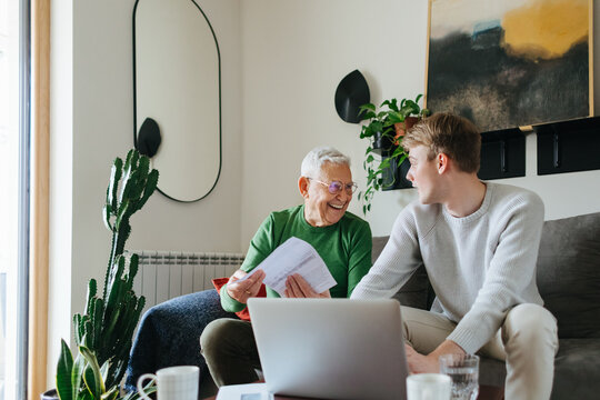 Young Man and His Grandfather at Home