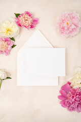 Beautiful fresh peony blooms and blank stationery card