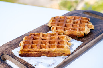 Belgian sugar waffles served on outdoor cafe terrace
