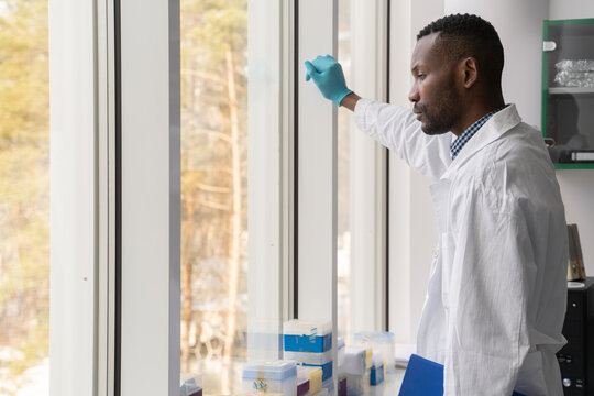 Researcher Looking Through The Window