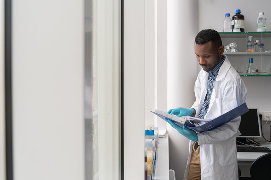 Scientist Analysing Data From Folder