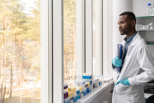Pensive Doctor Looking Through The Window