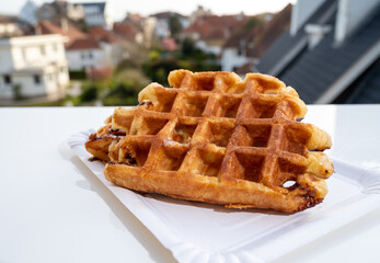 Belgian sugar waffles with black coffee served outdoor