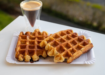 Belgian sugar waffles with black coffee served outdoor