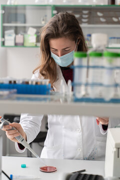 Scientist Working With Pipette in Lab