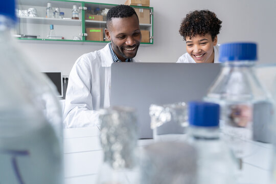 Researchers Using Laptop.