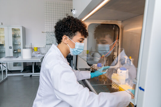 Researcher Working In A Chamber