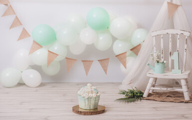 Fantastic mint colored birthday cake for a girl's or boy's birthday. Boho chic birthday photoshoot. First year photoshoot. Smash the cake photoshoot.