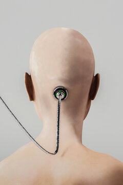 Rear view of a shaved head with a wire attached to the head