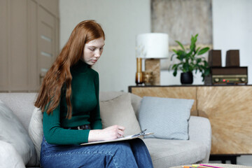 Woman fulfilling form about her well being 