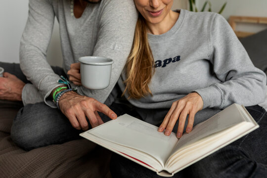 couple in bed reading book together