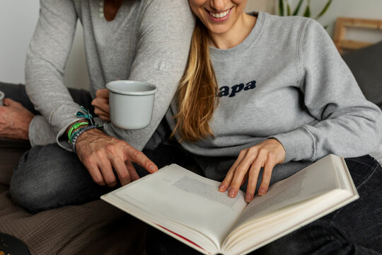 couple in bed reading book together