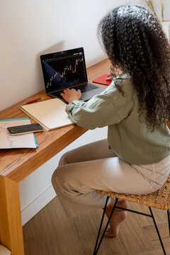 Trader working with stock chart on laptop
