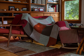 Child with Flashlight in Living room tent 