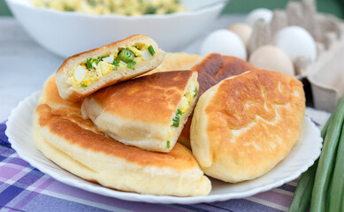 Fried yeast pies stuffed with green onions and eggs