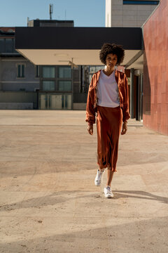 Tall and athletic black woman walking in the city