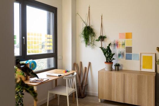 wooden desk by the window