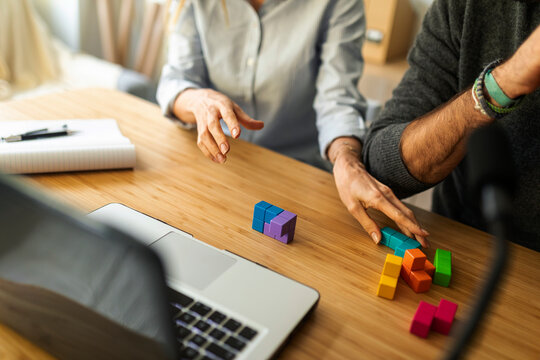 faceless couple recording video at home