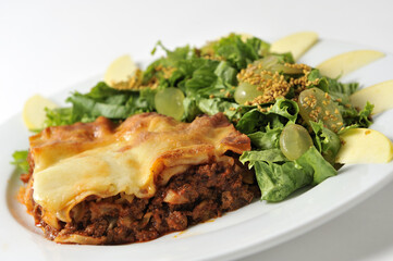bolognese lasagna with grape salad